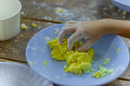 selective focus of children preparing dough for cooking Thai dessert.の写真素材