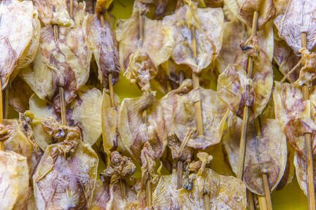 Asian street food - salted and dried fish and squid. Sun dried seafood at walking street  in Chiang...
