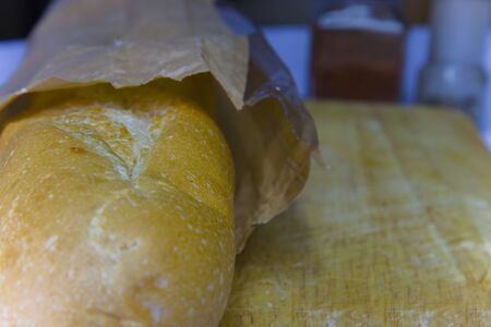 Fresh Baguette in a paper bag closeup copy space.High resolution image gallery.