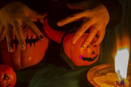 Halloween pumpkin head jack lantern with burning candlesの写真素材