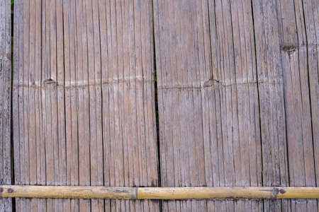 a woven bamboo wall in a rural village in northern Thailandの写真素材