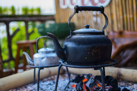 lack kettle On a traditional stove, Thai way, Thailand seletive focusの写真素材