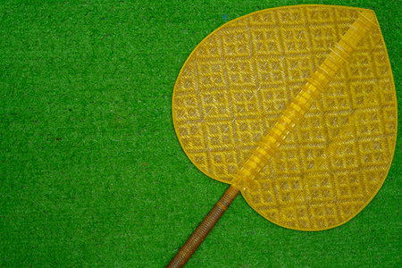 Christmas gift decorated with green branch, pine cone, gift bag red and silver beads garlans on knitting blacket . Xmas or New year green background, Merry Christmas greeting card.の写真素材