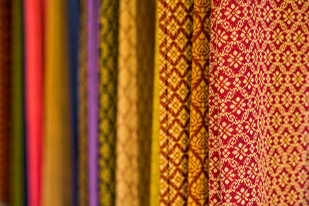 Raw of colorful Thai silk handcraft old vintage torn from natural materials texture background.の写真素材