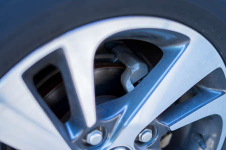 Close up of car tyre tread on the road on a bright day.の写真素材