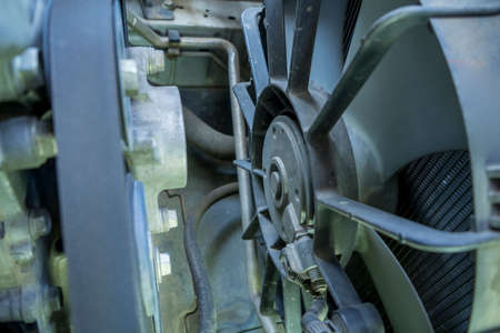 Fan of the radiator on the disassembled car,cooling system of an old car.