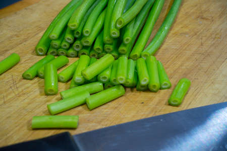 Onion flower, Allium cepa, Welsh Onion, Allium flower on chopping board.の写真素材