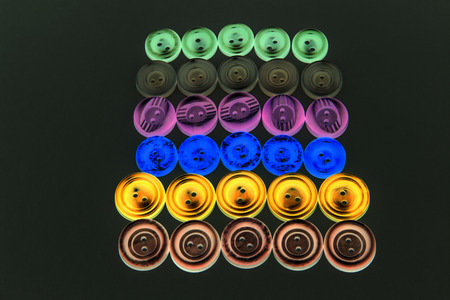 Collection of different buttons for clothes repair. Abstraction. Illustration. Set of colored...