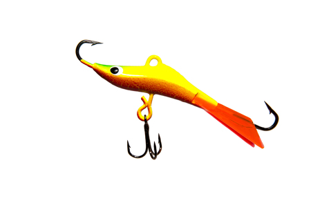 Winter bait balancer for predatory fish. Bright yellow. Red fin. On white background. Isolated.の写真素材