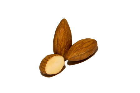 Close-up of almonds. Cut almonds. On white background. Isolated.の写真素材