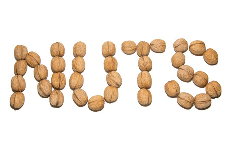 Close-up of walnut. A word made of walnuts. On white background. Isolated.の写真素材