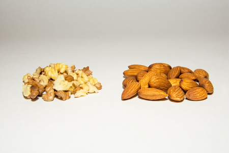 Close-up of walnut and almond. Fruits of walnuts and almonds. On a gray background. Isolated. Gradient.の写真素材