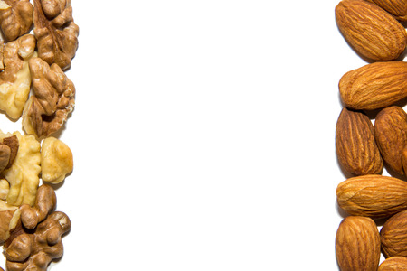 Close-up of walnut and almond. Fruits of walnuts and almonds. On white background. Isolated.の写真素材