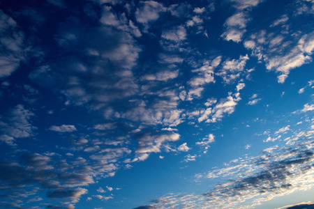 Beautiful celestial landscape. Clouds and sun at sunset. Clouds and sun at dawn. The radiance of the sunlight.の写真素材