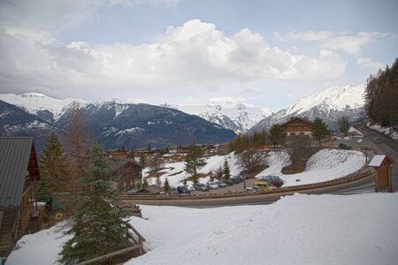 Panoramic view of ski resort three valleys and big lift in french alps - Vacation and travel concept - Winter high season opening with people having fun on mountain - Focus on sport equipmentの写真素材