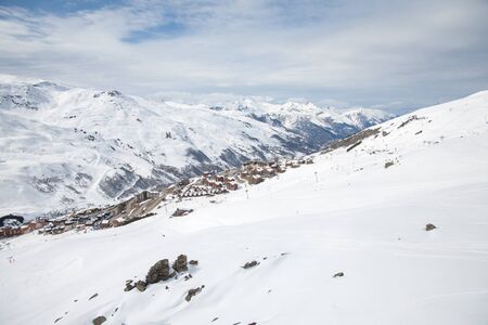 Panoramic view of ski resort three valleys and big lift in french alps - Vacation and travel concept - Winter high season opening with people having fun on mountain - Focus on sport equipmentの写真素材
