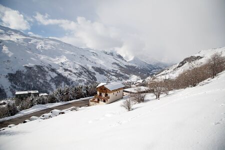 Panoramic view of ski resort three valleys and big lift in french alps - Vacation and travel concept - Winter high season opening with people having fun on mountain - Focus on sport equipmentの写真素材