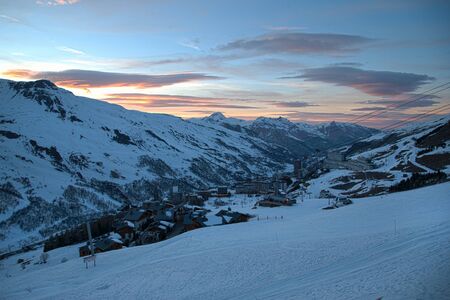 Panoramic view of ski resort three valleys and big lift in french alps - Vacation and travel concept - Winter high season opening with people having fun on mountain - Focus on sport equipmentの写真素材