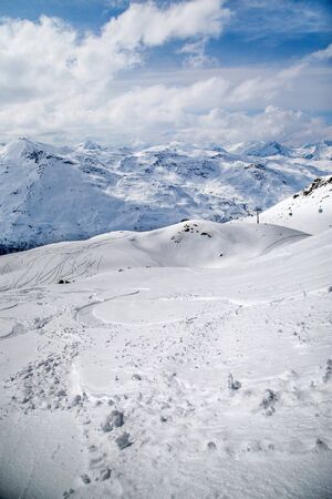 Panoramic view of ski resort three valleys and big lift in french alps - Vacation and travel concept - Winter high season opening with people having fun on mountain - Focus on sport equipmentの写真素材