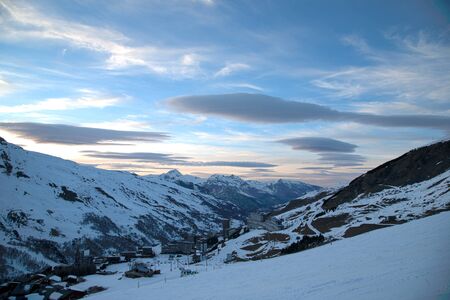 Panoramic view of ski resort three valleys and big lift in french alps - Vacation and travel concept - Winter high season opening with people having fun on mountain - Focus on sport equipmentの写真素材