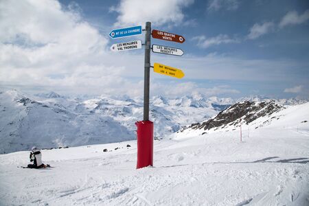 Panoramic view of ski resort three valleys and big lift in french alps - Vacation and travel concept - Winter high season opening with people having fun on mountain - Focus on sport equipmentの写真素材