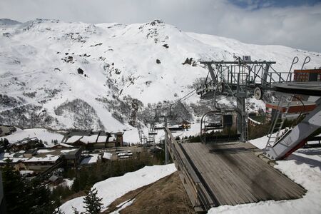 Panoramic view of ski resort three valleys and big lift in french alps - Vacation and travel concept - Winter high season opening with people having fun on mountain - Focus on sport equipmentの写真素材