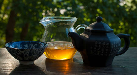 Traditional tea ceremony accessories, teapot and teacup in the sunlight