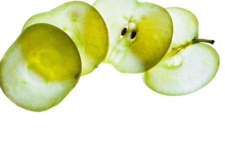 Slices of apple at the backlight isolated on a white background, macro photoの写真素材