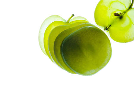 Slices of apple at the backlight isolated on a white background, macro photoの写真素材
