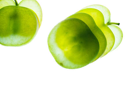 Slices of apple at the backlight isolated on a white background, macro photoの写真素材