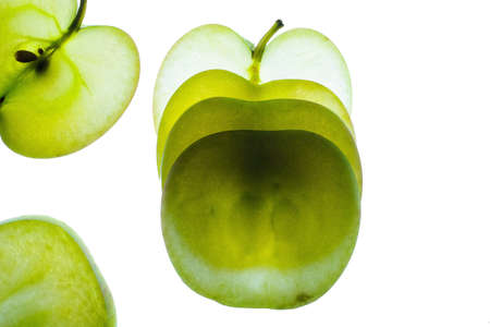Slices of apple at the backlight isolated on a white background, macro photoの写真素材