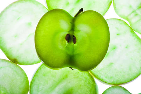 Slices of apple at the backlight isolated on a white background, macro photoの写真素材