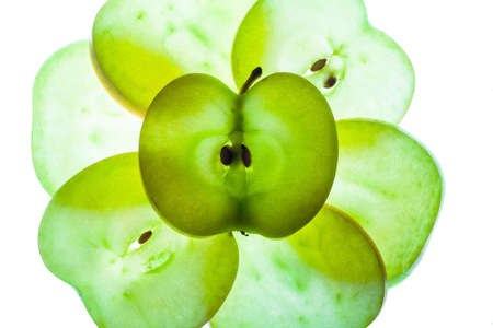 Slices of apple at the backlight isolated on a white background, macro photoの写真素材
