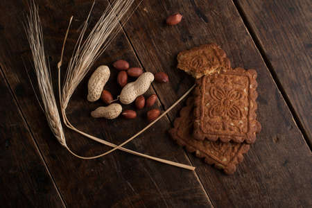 Cereal cookies and ingridients on the old wooden tableの写真素材