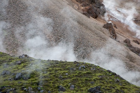 green and stony smoky slopes of the Landmannalaugar mountains in Icelandの写真素材