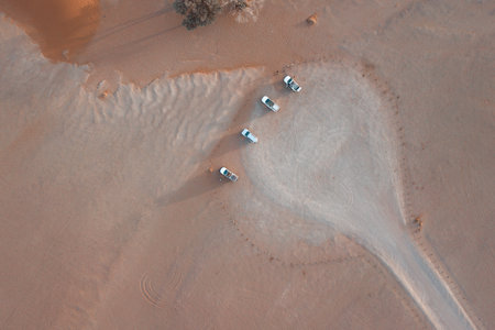 Aerial view of three cars in the Namib Desert, Sossuflei, Namibia. Top view