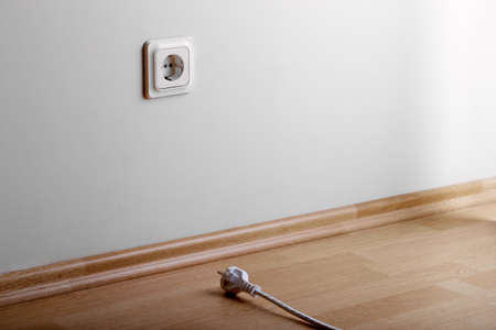 Problem to connect. White power socket on beige wall at low height from the floor and a short cable...