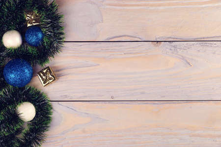 Flat lay Christmas composition. New year card gift. Balls, presents, snowballs. green tinsel. On...
