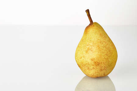 Pear fruit isolated on the white background. Single fresh juicy yellow-green.の写真素材