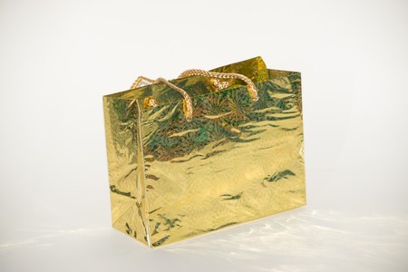 Gifts gold close-up on a white backgroundの写真素材