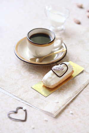 Traditional French Eclairs with Marzipan Pastry Cream, on light background.