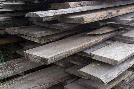Wooden boards are stored on the street