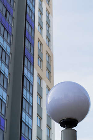 glass building high and ball street lampの写真素材