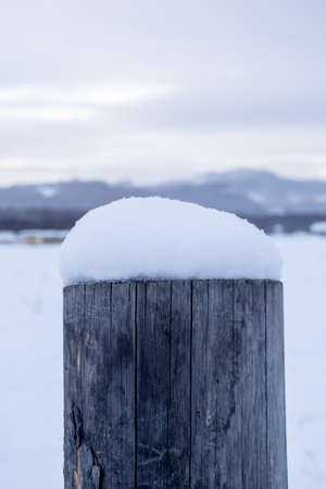 snow cap on the pillar in winterの写真素材