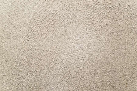 Concrete background. Plaster on the wall. Embossed textured surface.