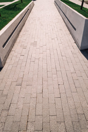 The brick path goes into the distance. The prospect of converging lines.の写真素材