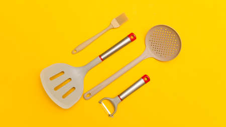 Set of kitchen utensils on a yellow background.の写真素材
