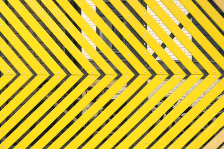 Abstract light yellow arrow shapes background. quality photoの写真素材