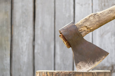 Old village axe against the background of boardsの写真素材