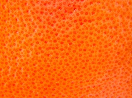 peel of ripe grapefruit as a backgroundの写真素材